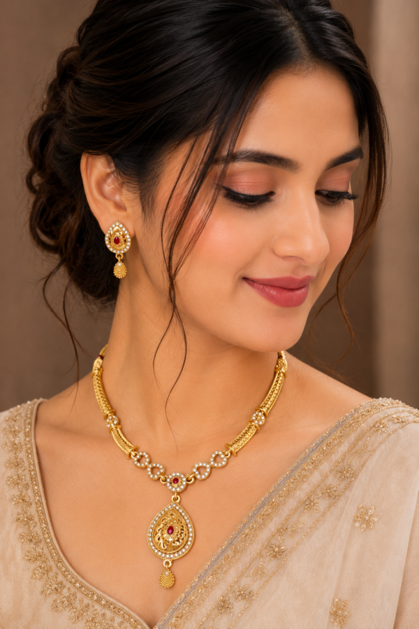 Traditional gold tone necklace set with matching earrings for wedding, festive and ethnic wear.