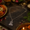 Person wearing Mahadev Shiva pendant necklace with traditional outfit