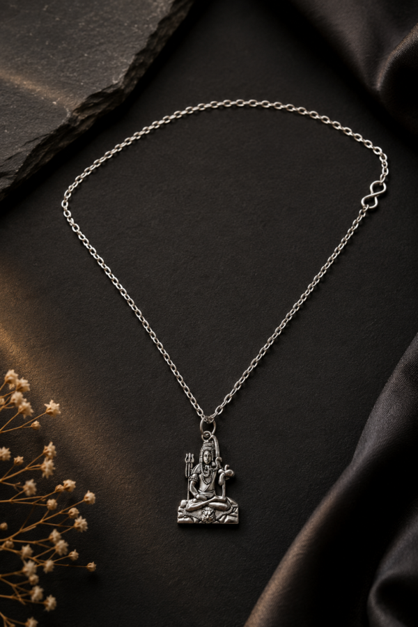 Close-up of Lord Shiva Mahadev pendant with detailed silver finish