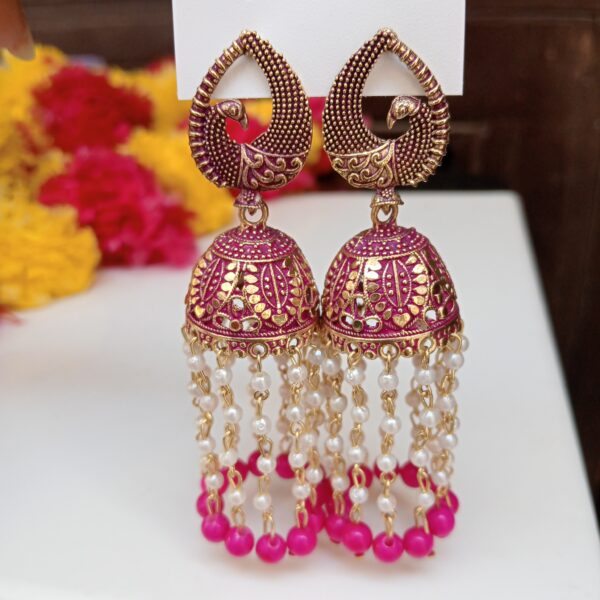 Pink Ethnic Pearl Tassel Jhumkas Pink ethnic jhumka earrings with pearl hanging chains