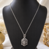 Traditional Silver Finish Mata Locket Elegant Religious Pendant Necklace crafted with intricate Mata face detailing and silver finish. Stylish Women's Jewellery for festive and spiritual occasions.