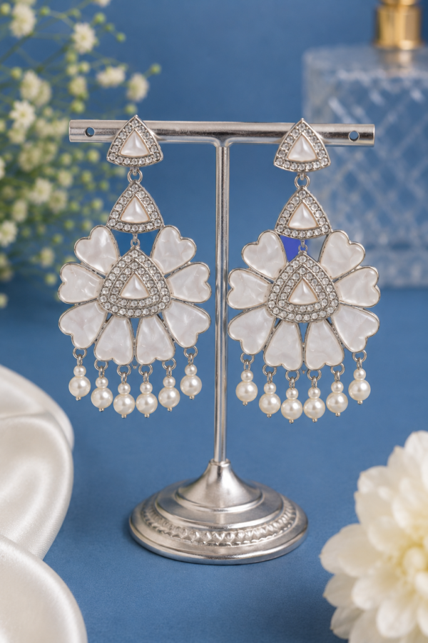 Floral Pearl Drop Earrings Floral pearl drop earrings with white petal and sparkling detailing