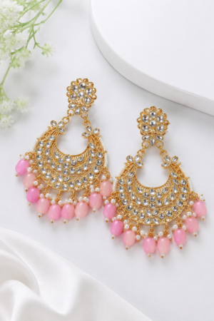 Gold finish pink beaded chandbali earrings with white detailing