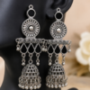 Traditional silver jhumka earrings with floral and geometric detailing