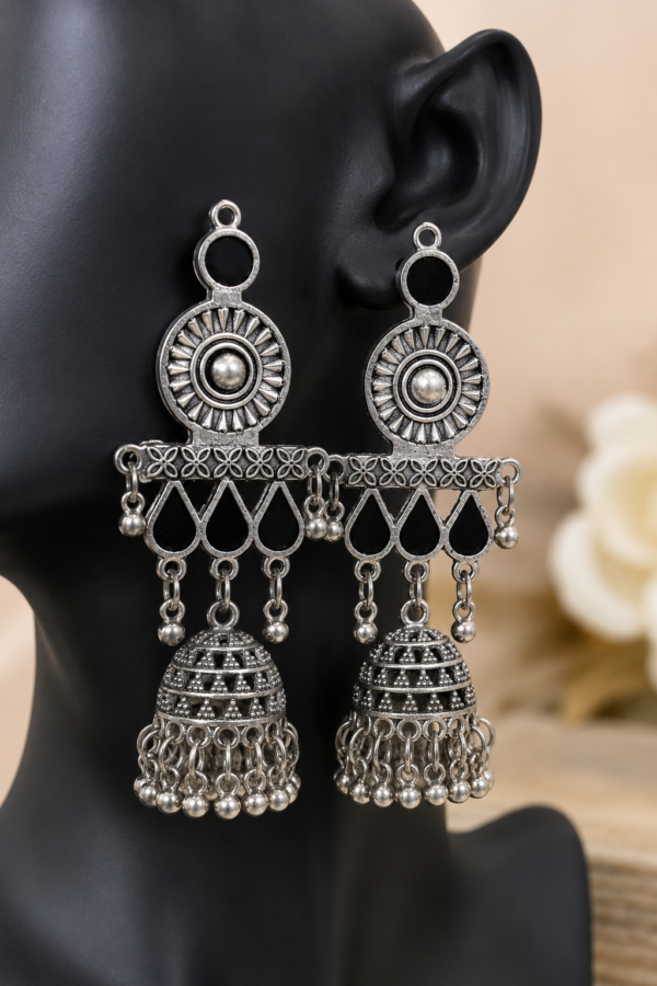 Traditional silver jhumka earrings with floral and geometric detailing