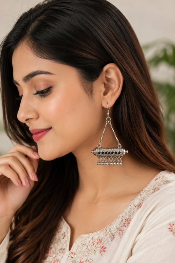 Designer Silver Tone Ethnic Drop Earrings Designer ethnic-inspired earrings with silver tone finish and black accents
