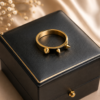 Bold men's gold finish spike ring with modern black detailing Men's gold finish spike ring with black centre detailing