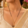 Black Beaded Mangalsutra Black beaded mangalsutra with delicate gold-tone decorative beads
