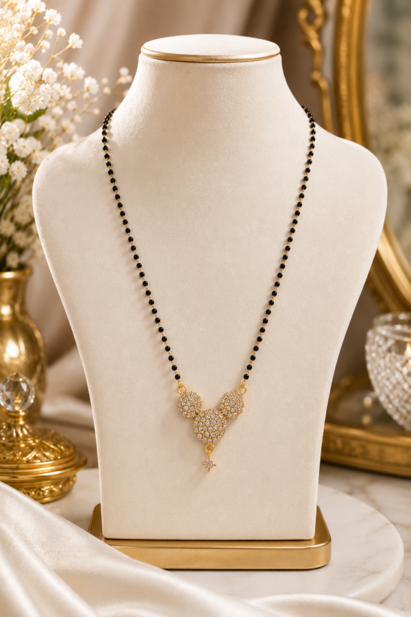 AD Black Beaded Floral Mangalsutra AD black beaded mangalsutra with gold floral pendant