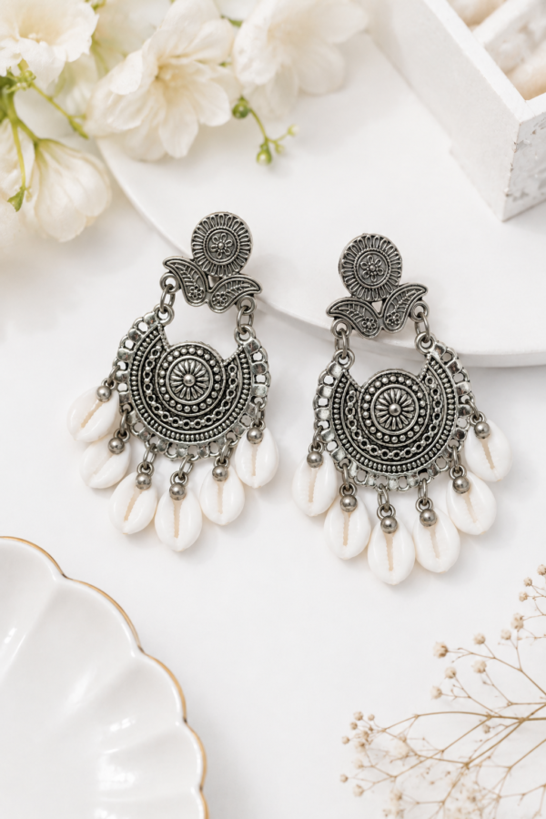Floral silver drop earrings with white hanging shell details