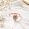 Rose Gold Tone Green Teardrop Ring Rose gold tone ring with green teardrop stone and floral inspired detailing