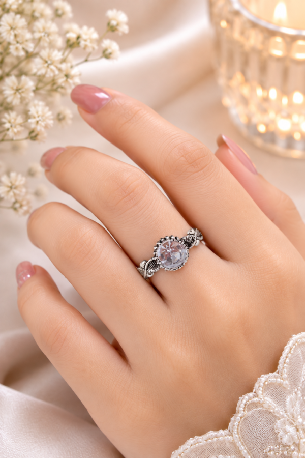 Silver Tone Designer Ring with Clear Stone Designer silver tone ring with clear centre and leaf detailing
