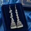 Pearl Jhumka Earrings Silver Tone Design Pearl jhumka earrings with white bead detailing and silver-tone finish
