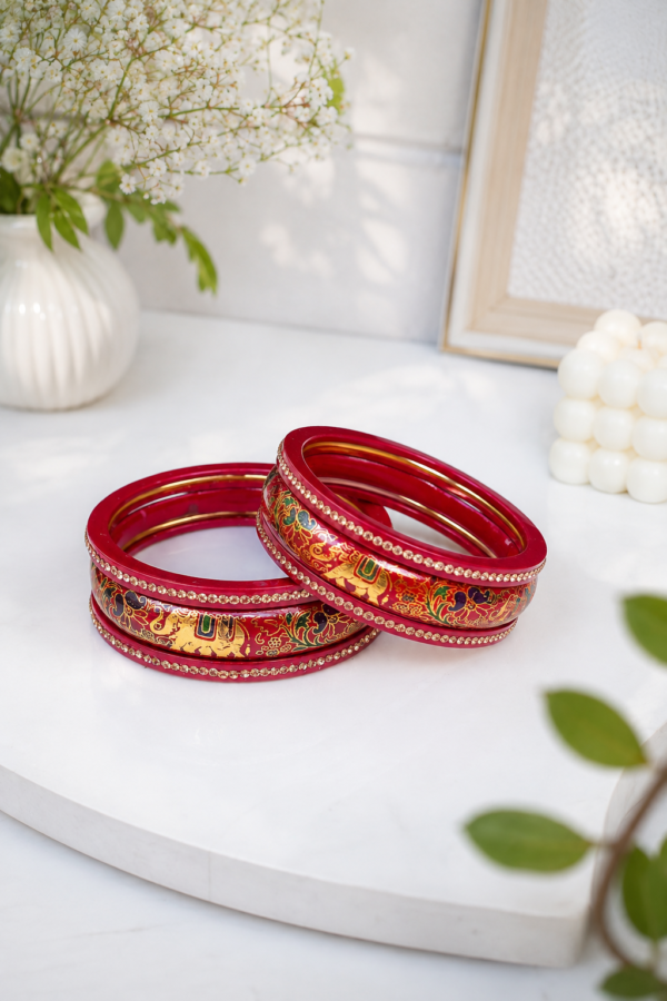 Traditional Maroon Lac Bangles Traditional maroon lac bangles with golden floral-inspired design