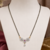 Floral Stone Mangalsutra Black Beaded Design Floral stone mangalsutra with black beads and designer pendant