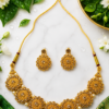 Gold Finish Floral Necklace Set Gold finish floral necklace set with matching earrings and pearl-like beads