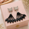 Butterfly Drop Earrings with Black Oval Beads Butterfly drop earrings with black oval beads and silver-tone detailing