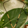 eceba7c8-25e7-4f09-9fa1-849d6eb5a4ed Black Beaded Mangalsutra for Women – Elegant Gold-Tone Design
