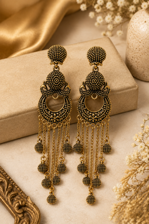 Gold tone statement earrings with long chain and bead details