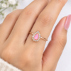 Pink Pear-Shaped Stone Ring Close-Up Close-up of pink pear-shaped stone ring with clear decorative stones