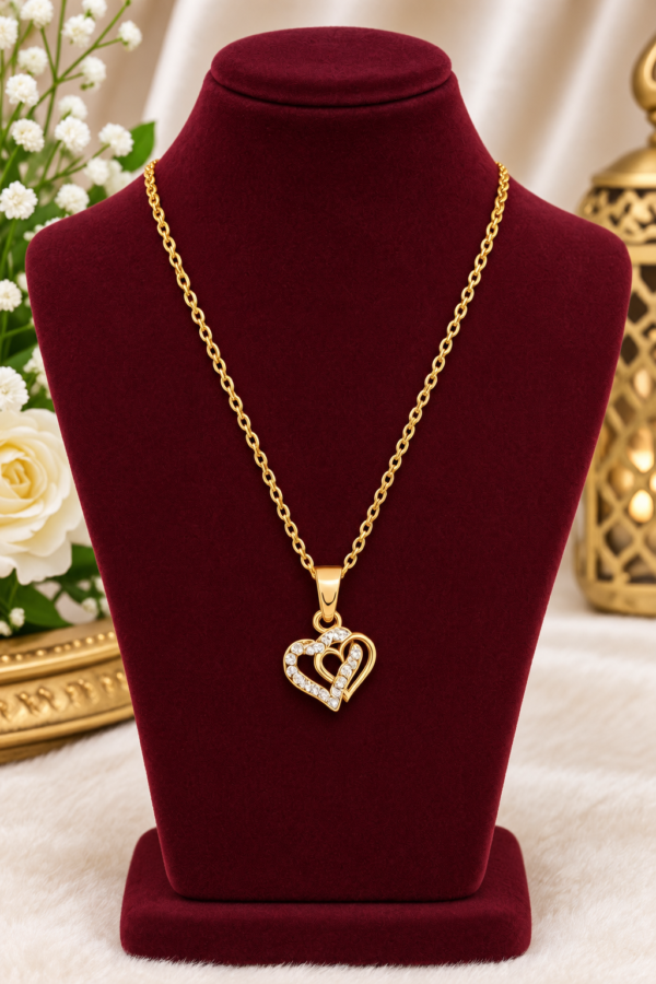 Heart necklace with sparkling-looking clear stone accents