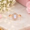 Oval white stone ring with rose-gold-tone band