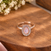 Pink oval centre ring with sparkling white stone halo