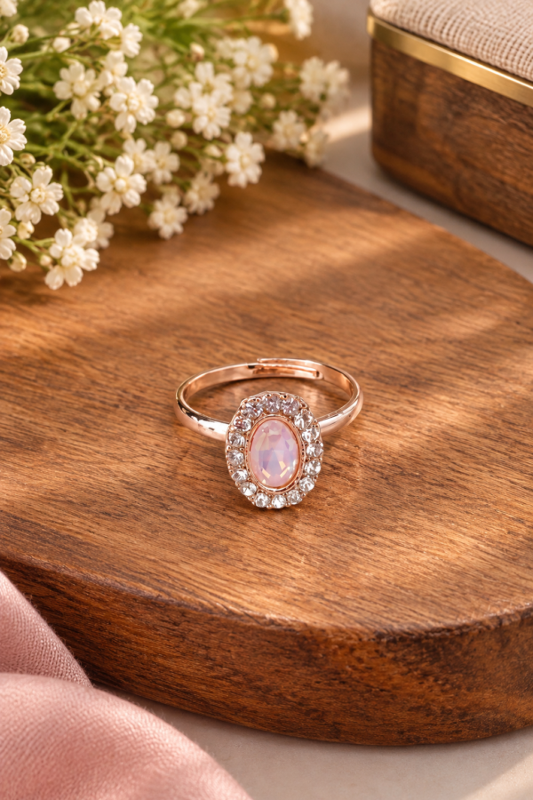 Pink oval centre ring with sparkling white stone halo