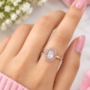 White oval centre ring with clear sparkling stone halo