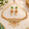 Gold tone necklace with green floral and leaf motifs