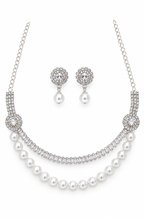Silver tone pearl necklace with circular decorative motifs
